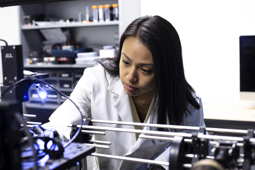 A student researcher prepares a lymph node for scanning by a cancer imager