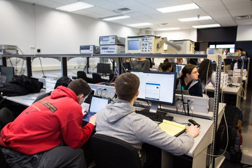 Photo of electrical engineering students at work in a lab