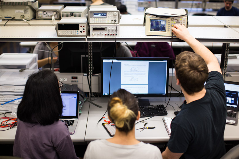 Photo of electrical engineering students at work in a lab