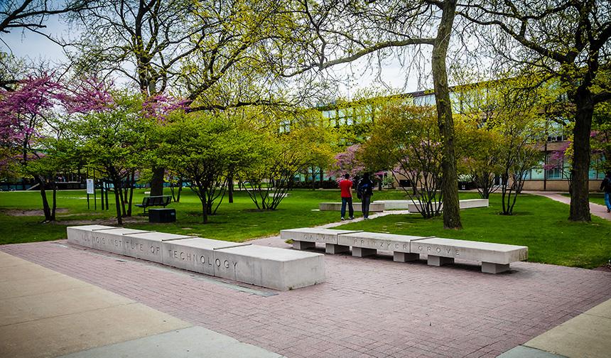 Students walking outside on Mies Campus in the Pritzker and Galvin Grove