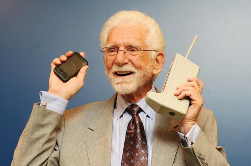 A photo of Marty Cooper holing a cell phone