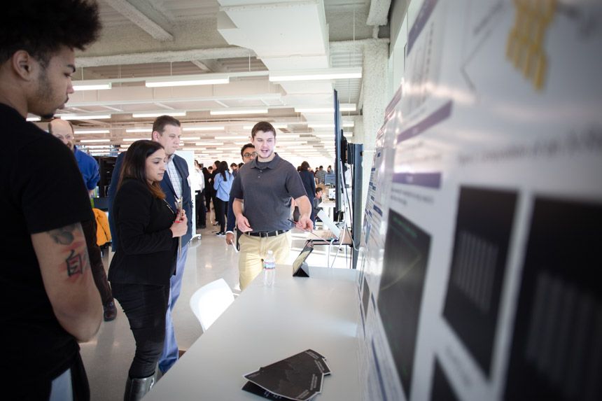 Photo of students making presentations at IPRO day