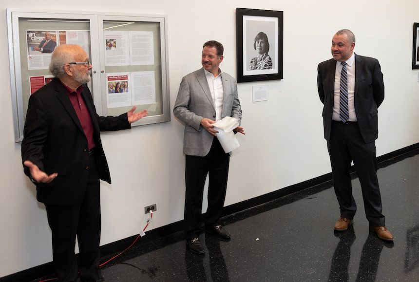 Hassan Nagib giving remarks, Louis Cattafesta and Kenneth Christensen standing to the right