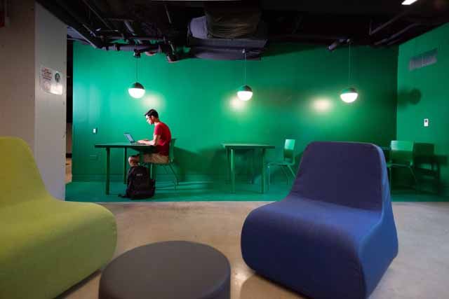 A student studies in a common area in Kacek Hall