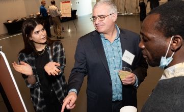 An applied mathematics student explains her research to Illinois Tech faculty