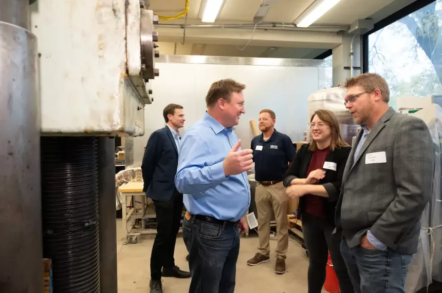 Illinois Tech faculty standing in Concrete Materials and Structures Lab.