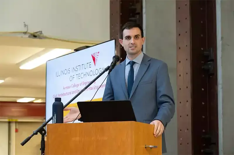 Assistant Professor of Civil Engineering Matthew Gombeda speaks at the open house.