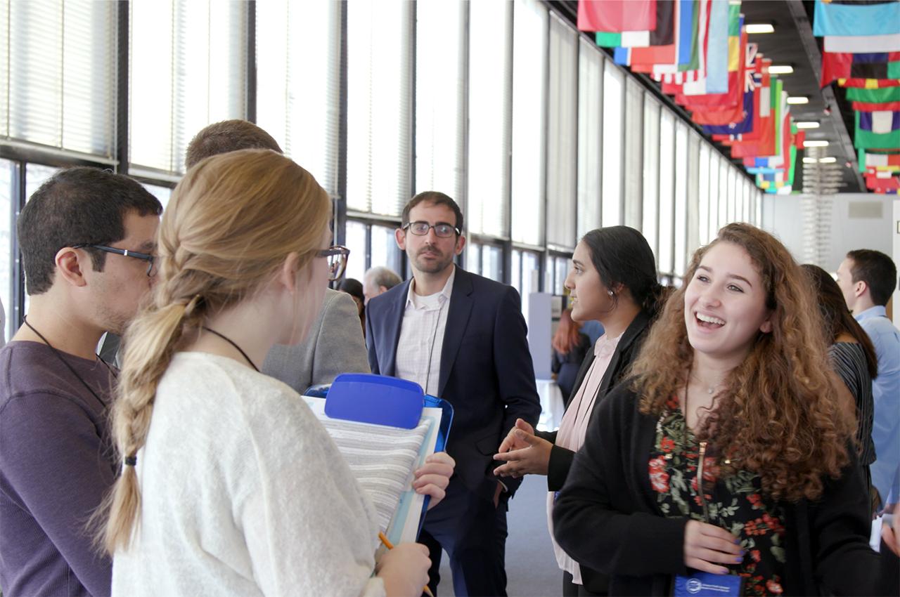 A student explains her research at the STEM exhibition