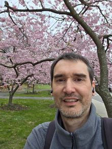 Headshot of Renato Orsi, senior research associate at Cornell University in front of trees