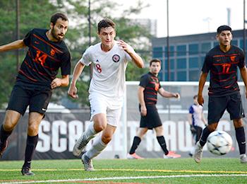 A photo of Illinois Tech's men's soccer team playing against another university