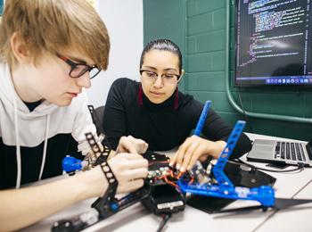 SAT - School of Applied Technology - photo of students working on drones