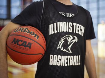 A student holds a basketball