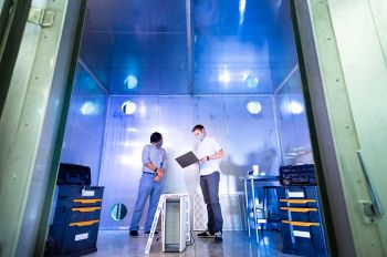 Assistant Professor of Architectural Engineering Mohammad Heidarinejad and Professor of Architectural Engineering Brent Stephens work in a lab at Illinois Tech