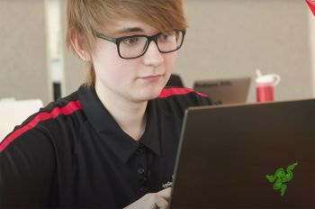 Travis Smith works on a computer