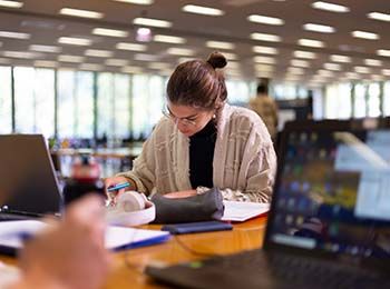 Student working in the library