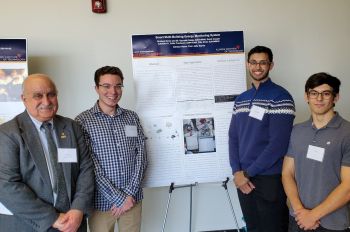 Jafar Saniie, Colin Prochnow, Saurabh Saluja, and Filip Živko with research poster