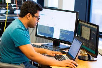 Information Technology and Management student works in a computer lab