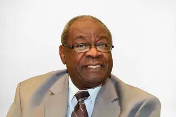 Nate Thomas, Honorary Doctor of Engineering awardee, sits in front of a neutral background.