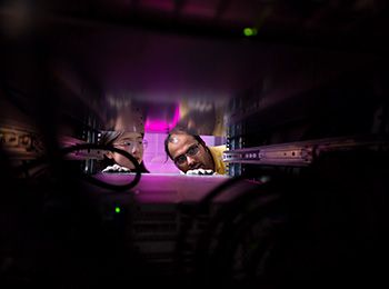 Illinois Tech students work on a server in an Illinois Tech computing research lab