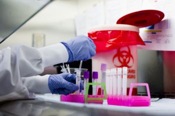 Photo of student using lab materials