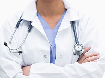 Close-up of health care provider with stethescope over shoulders