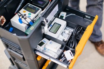 Suite of monitoring instruments used by researchers to track indoor and outdoor air quality and ventilation system operation