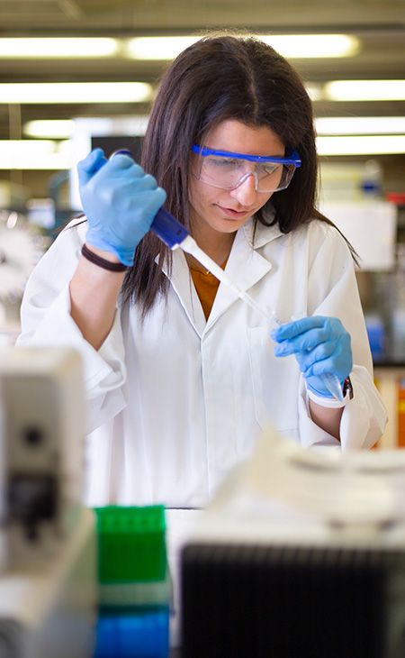 Jasmine Baste working in a lab