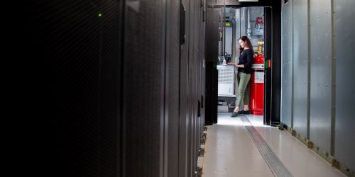 Photo of professor working in a data center