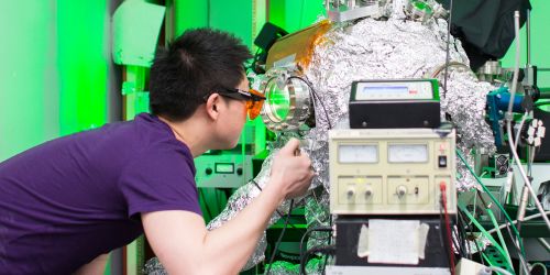 An undergraduate student working in a physics lab