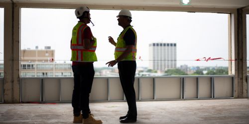 Photo of engineers on site of Bailey Hall construction