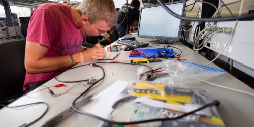 Photo of electrical engineering student working in a lab