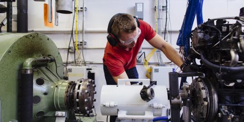 A student works on an engine