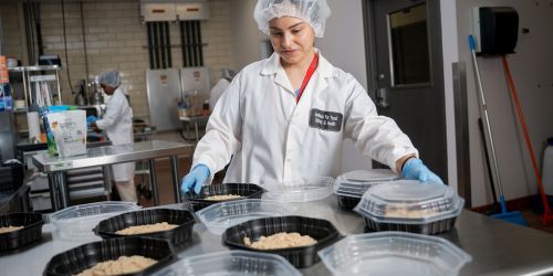 A worker packs food at Illinois Tech's Institute for Food Safety and Health