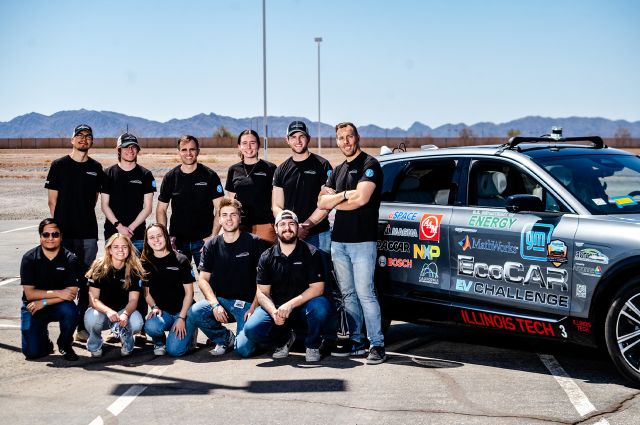 Image: Illinois Tech EcoCAR team posing in front of their car at vehicle testing week in Yuma, Arizona.