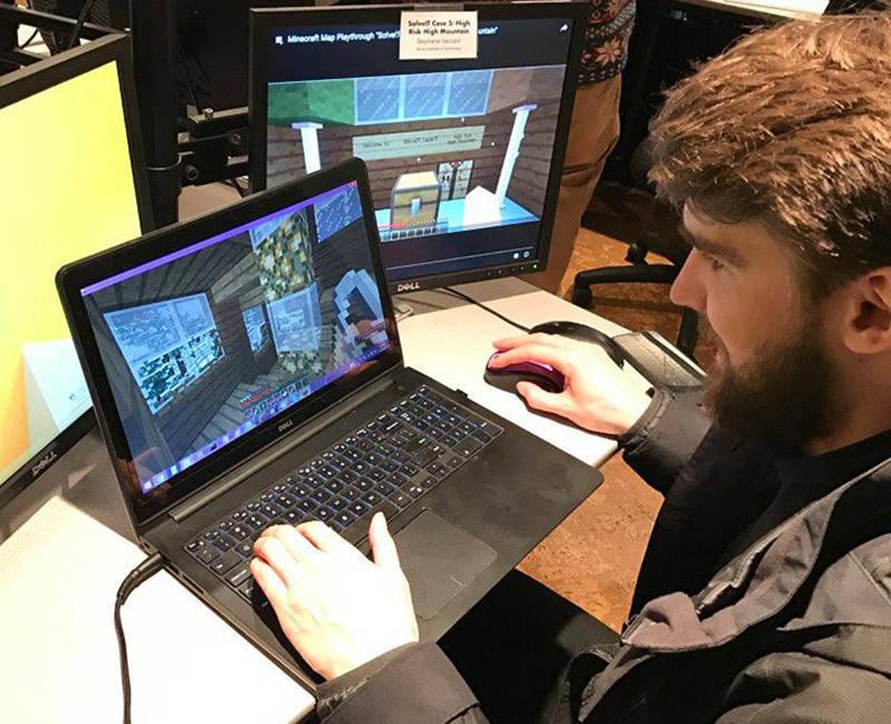 Student at laptop gaming