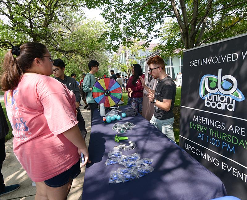 Students talking to each other at the student organization fair