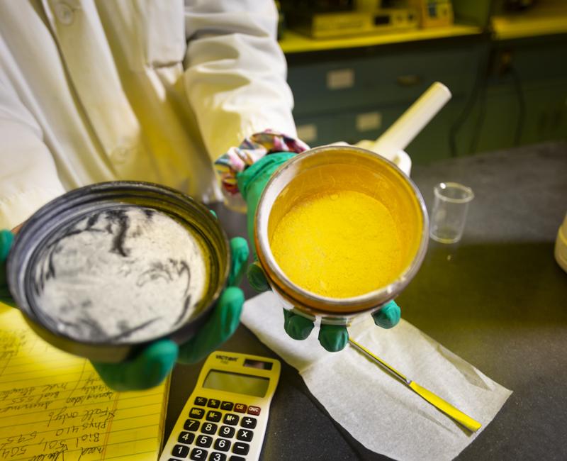 A researcher displays experimental drugs