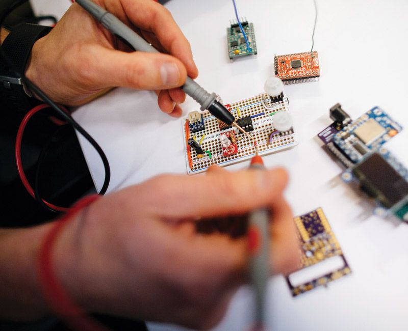 Photo of electrical engineering student working in a lab