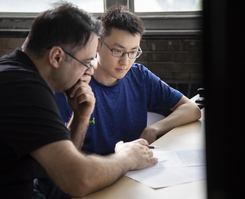 A student has a paper edited in the writing center