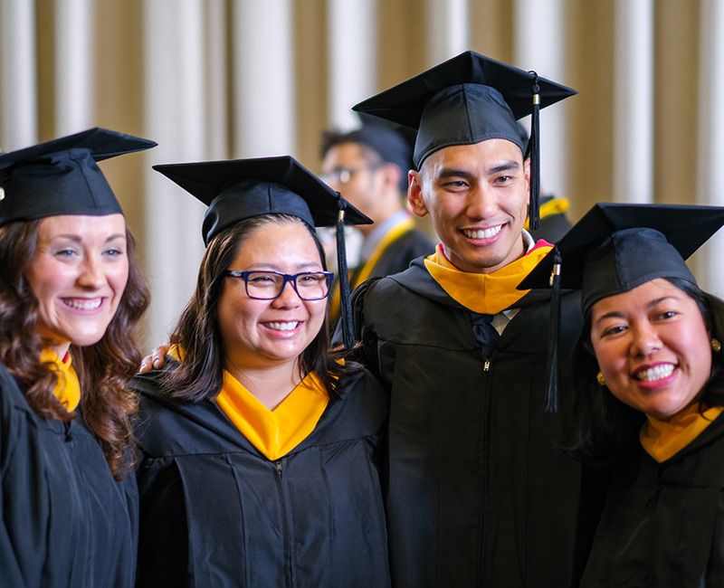 Four graduating students