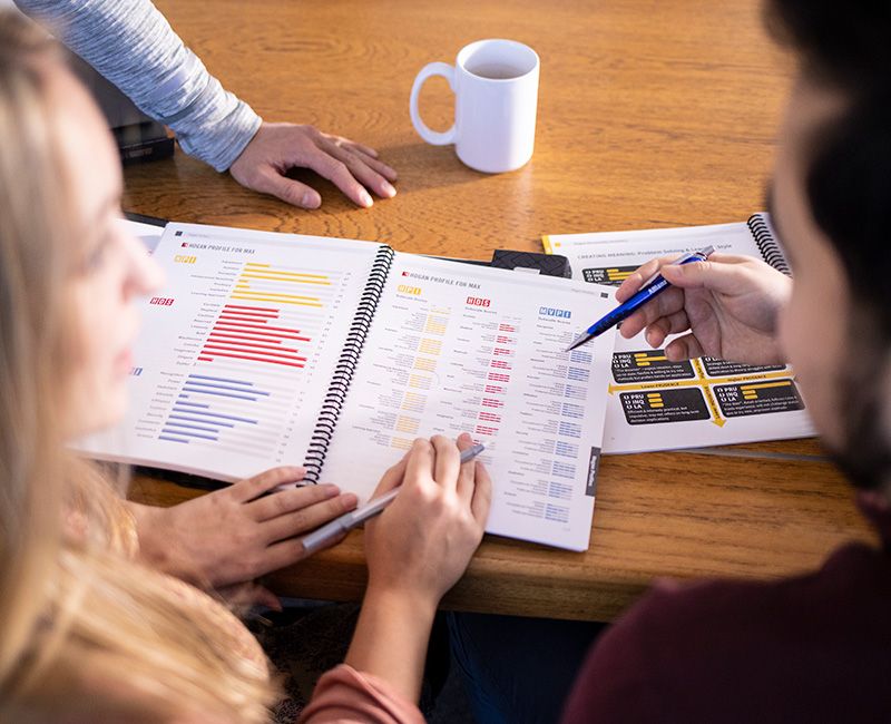 People reviewing report at desk