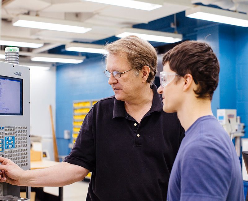 Craig Johnson with Student in the Armour Machine Shop