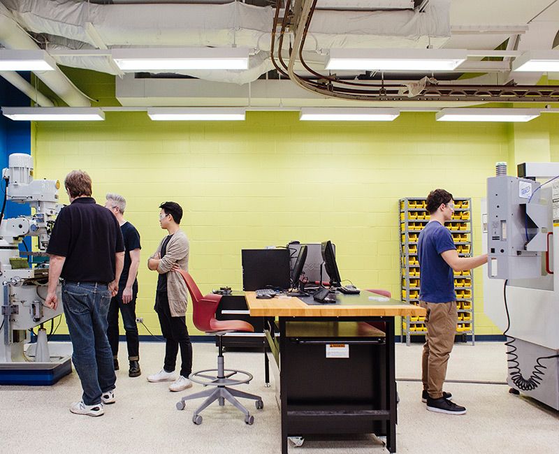 Picture of the machine shop with students working