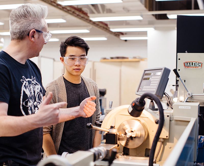 Machine Shop students working at lathe