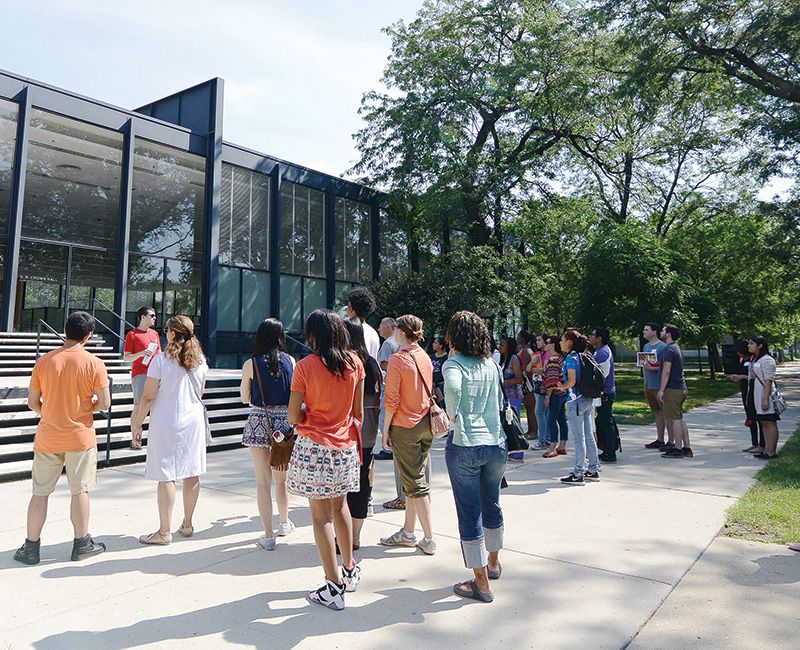 Group of students visiting in front of Crown Hall